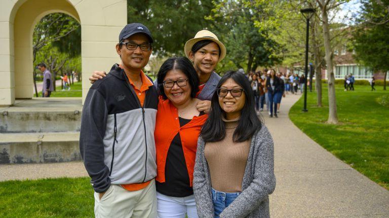 Student on campus with family