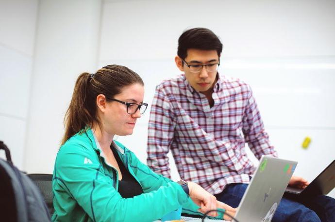 Students studying at laptop