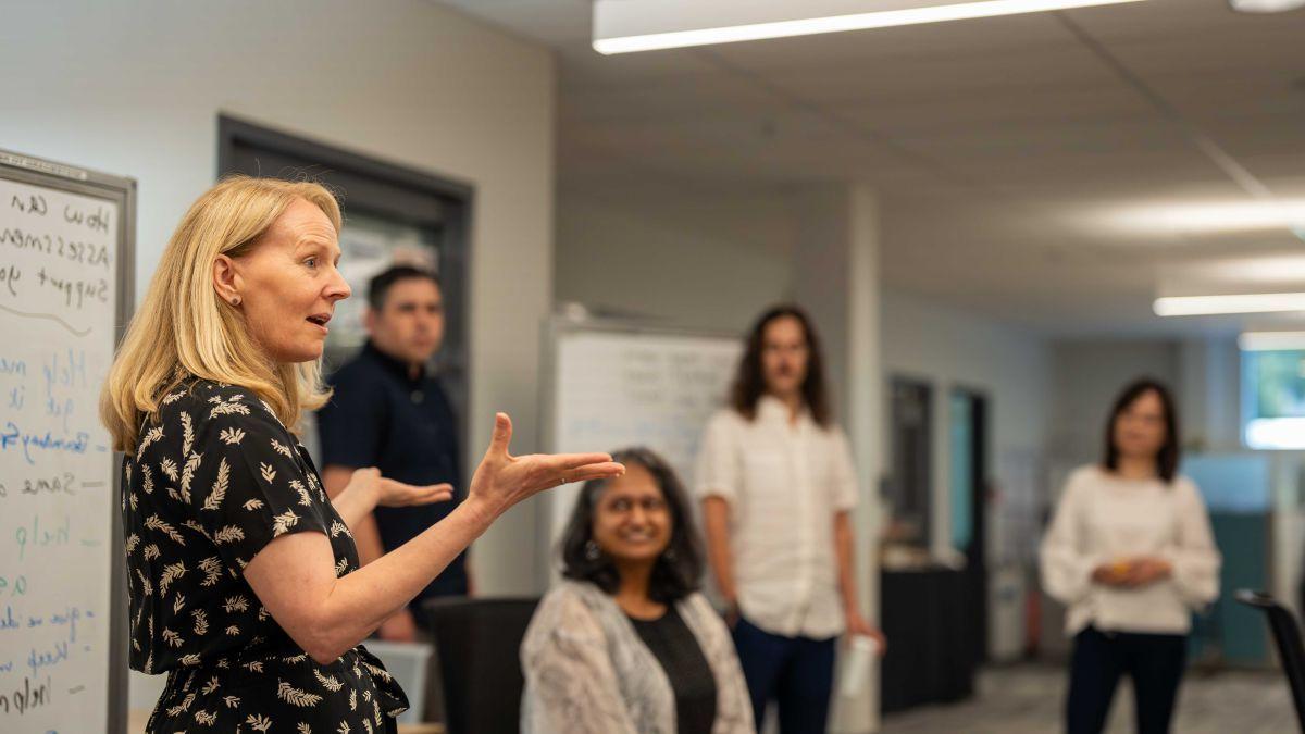 On the right, Leslie Bayers participates in a Faculty Fellows program meeting.