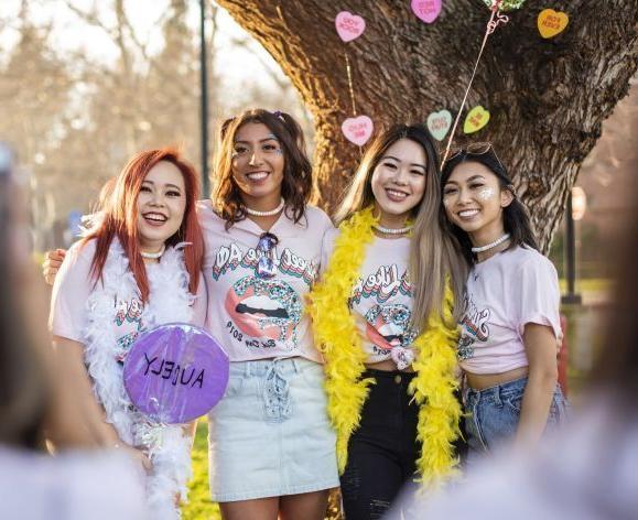 four female students wearing colorful clothes